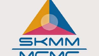 Brand logo featuring a large multicolored triangle (orange left, blue right, pink base) with a circular overlap, above the blue text 'SKMM MEMC' separated by a horizontal line.