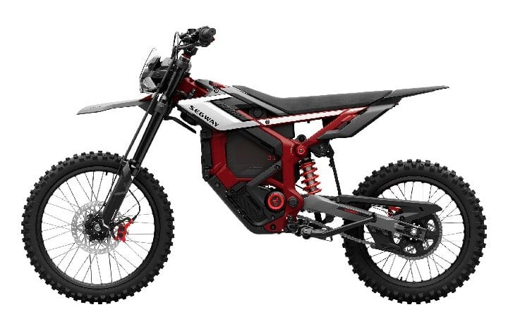 Electric off-road motorcycle with a red frame, black knobby tires, and visible battery pack in a side profile view.