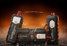 ancel bs300 - Wilayah.com.my Portable car jump starter with dual battery packs on either side and a central control unit, glowing orange background.