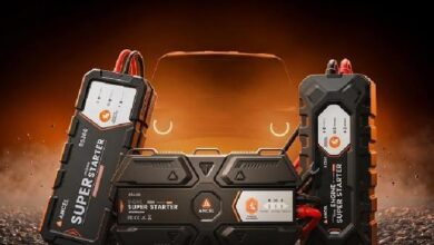 ancel bs300 - Wilayah.com.my Portable car jump starter with dual battery packs on either side and a central control unit, glowing orange background.