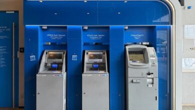 atm bank - Wilayah.com.my Three self-service ATMs in a blue bank alcove; two are for cash withdrawal/deposit and one is a cheque deposit machine nearby.