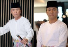 beto kusyairy 2 - Wilayah.com.my Man in white traditional outfit and black cap, holding a microphone in a split-screen pose, indoor setting