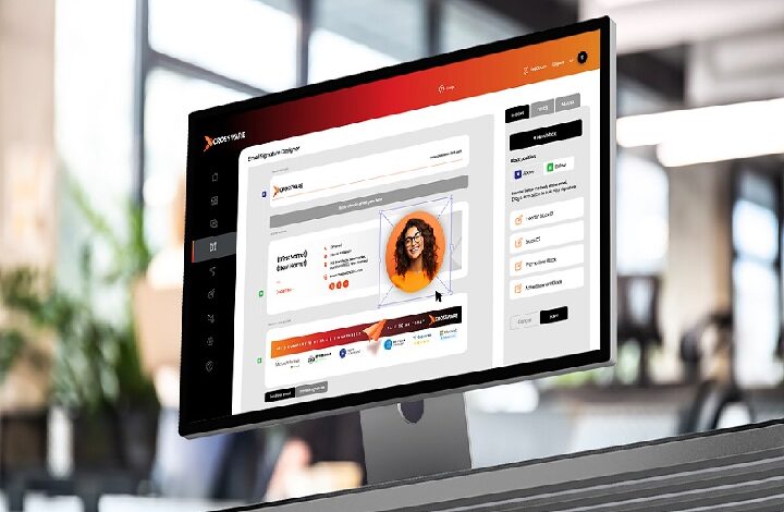 Tilted computer monitor displaying a dashboard UI with a user profile card in an office setting