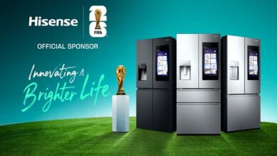 Hisense FIFA sponsorship banner with three modern refrigerators on a green field, a trophy, and the slogan 'Innovating a Brighter Life' on a teal background.] , Actually remove comma? Need proper JSON string.