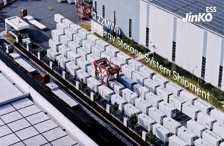 jinko ess - Wilayah.com.my Outdoor yard of energy storage containers beside a warehouse; red forklift visible, overlay text reads '22MW Energy Storage System Shipment', ESS Jinko logo in corner.