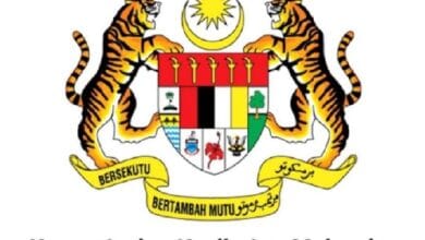 Coat of arms of Malaysia with two tigers flanking a shield, crescent and sun above, and banner; represents Kementerian Kesihatan Malaysia (Ministry of Health Malaysia).