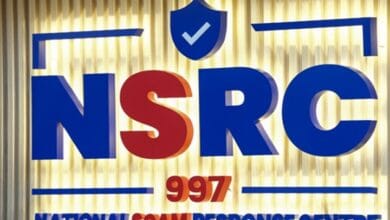 nsrc - Wilayah.com.my Sign for the National Scam Response Centre (NSRC) with 997, featuring blue and red letters and a blue shield with a checkmark on a gold background.