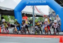 pushbike lion rocket - Wilayah.com.my Young children on small bikes race at a start line under a blue Decathlon arch, with spectators watching nearby.