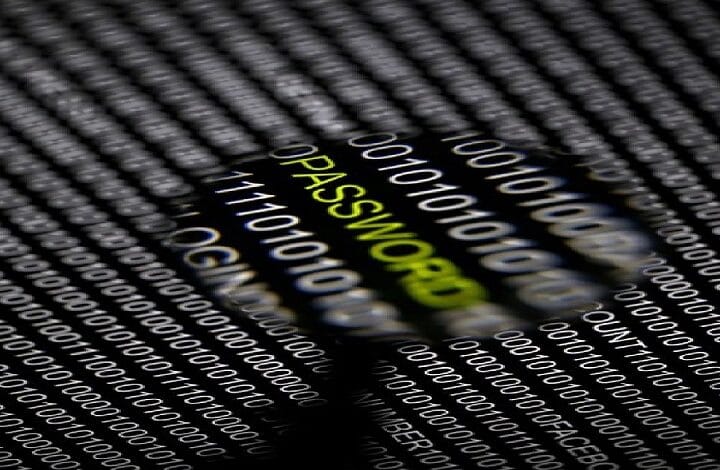 security hack data 2 - Wilayah.com.my Close-up of a magnifying glass over the word PASSWORD in green, with a binary code background.