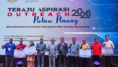 Group of people on a stage posing with certificates in front of a banner reading Teraju Inspirasi Outreach 2026 Pulau Pinang.