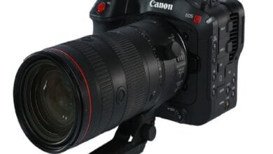 canon eos70 - Wilayah.com.my Canon EOS camera with a large zoom lens mounted, shown from a front-left angle.