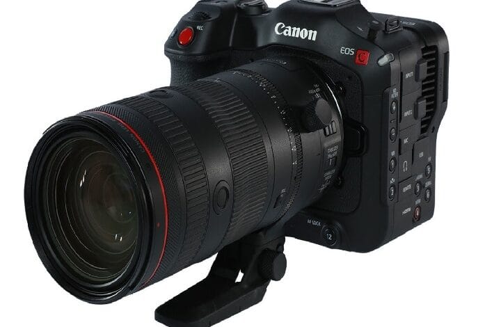 Canon EOS camera with a large zoom lens mounted, shown from a front-left angle.