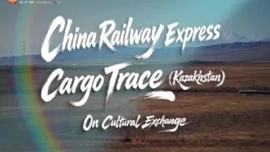 china railway express - Wilayah.com.my Poster banner for China Railway Express Cargo Trace (Kazakhstan) on Cultural Exchange, set against a desert landscape with a rainbow arc in the foreground.