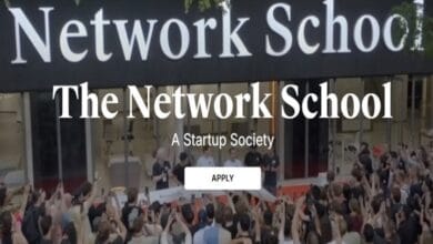 network school - Wilayah.com.my Crowd gathered in front of a building with the headline 'The Network School', a subtitle 'A Startup Society', and a visible 'APPLY' button on a startup-ecosystem landing page.