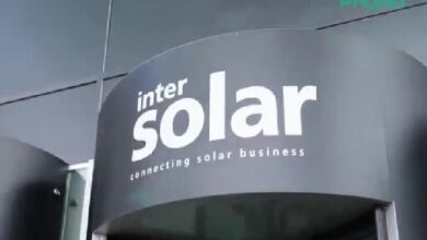 phono 2 - Wilayah.com.my Outdoor storefront sign displaying 'inter solar' with the tagline 'connecting solar business' on a curved dark wall.