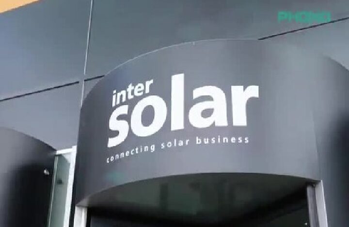 phono 2 - Wilayah.com.my Outdoor storefront sign displaying 'inter solar' with the tagline 'connecting solar business' on a curved dark wall.