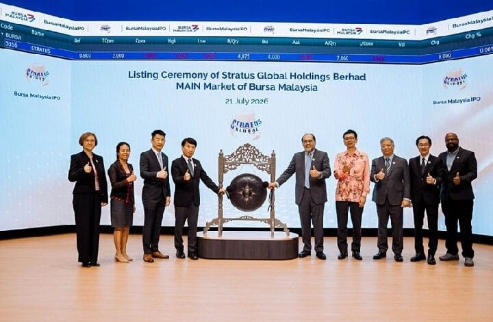 Group of ten executives posing with a ceremonial gong on stage during the listing ceremony for Stratus Global Holdings Berhad at Bursa Malaysia Main Market, July 21, 2026.