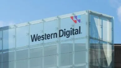 western digital 2 - Wilayah.com.my Glass-walled building with the Western Digital logo and name against a blue sky.